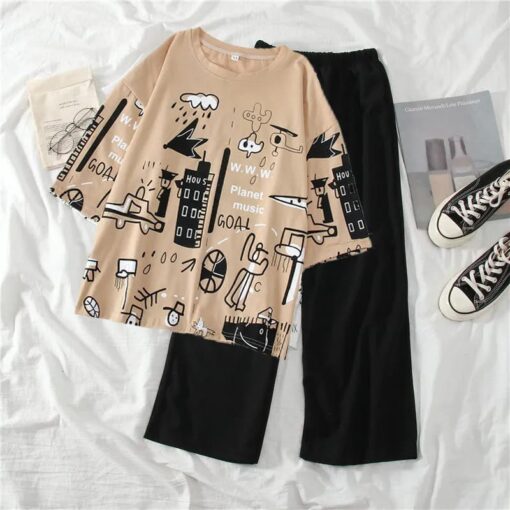 Black Plain Trousers Paired with Skin Planet Music Graphic Shirt